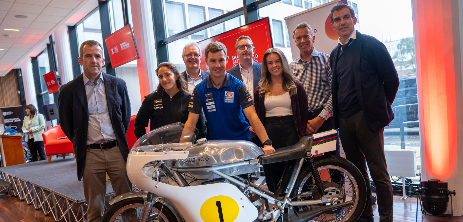 A group of people pictured at the From Tech to Track event at Queen's University